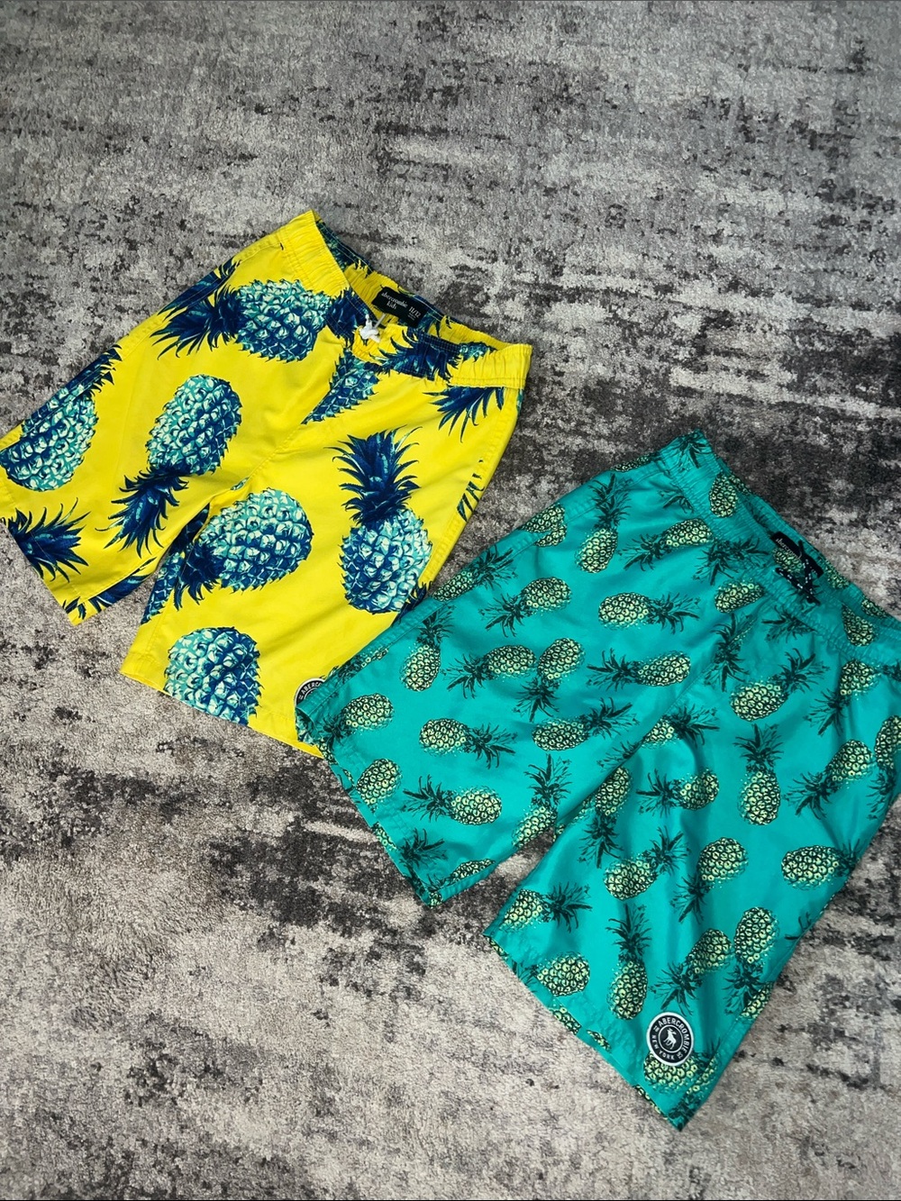abercrombie kids Yellow & Teal Pineapple Swim Shorts. Two pair.